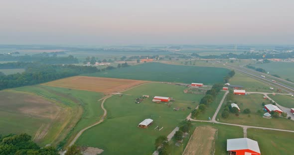 Panoramic View with Beautiful Misty Village Landscape Meadow in Fog Early Morning Sunrise alt