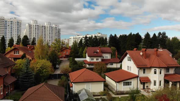 Onestory Residential Buildings on Background of Highrise Buildings in Russia