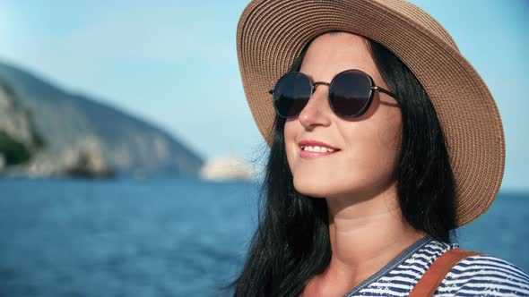 Closeup Face of Fashionable Travel Woman with Tanned Skin Face alt