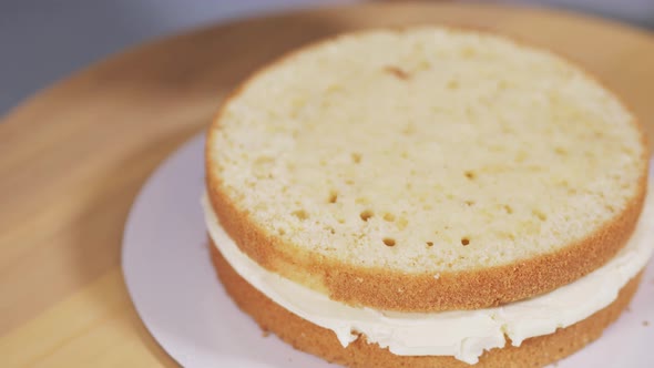 The Pastry Chef Applies the Impregnation for the Sponge Cakes of the Cake alt