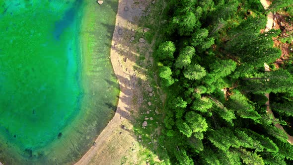 Top down of mountain lake Carezza, Dolomites, Italy alt