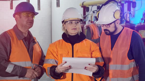Woman with Workers Read Papers Checking Industrial Complex