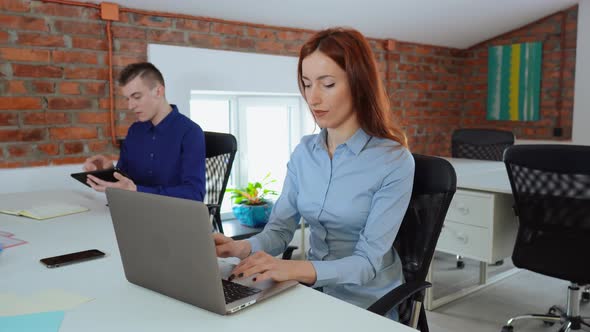 Two Business People Focused at Work