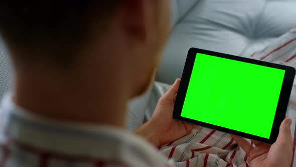 Closeup Hands Holding Chroma Key Tablet alt