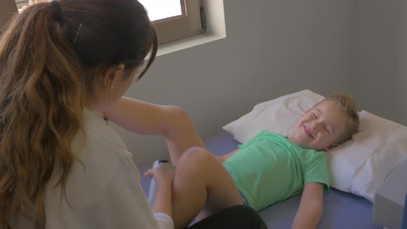 Child taking physiotherapy session alt