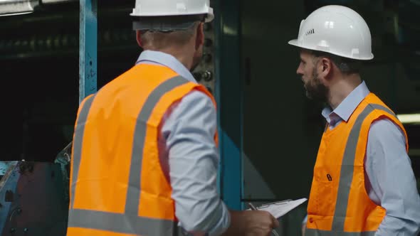 Engineer Describing Work of Industrial Paper Machine alt