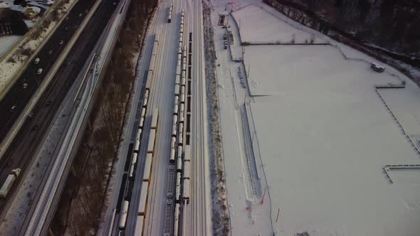 Drone shot of trains in winter with freshly fallen snow and Mount Baker