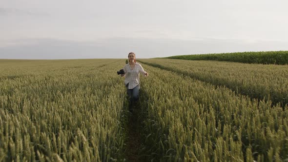 Slow Motion of a Pretty Girl That Running on the Wheat Field alt