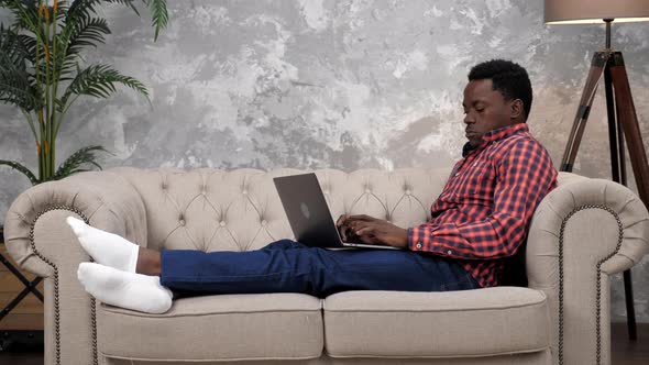 African American Businessman Work Laptop Online Chatting with Employees Sneezes alt