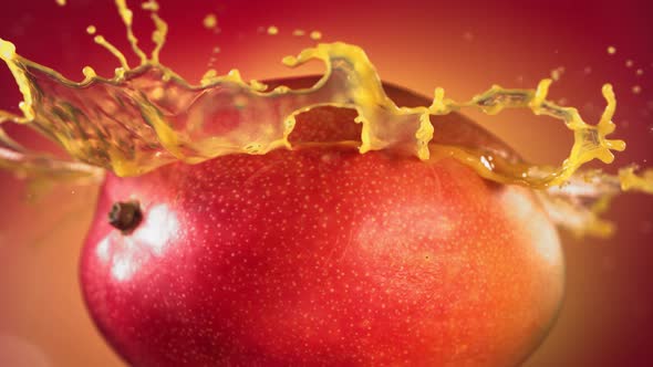 Mango Slice Falling and Splashing on Yellow Pink Background alt