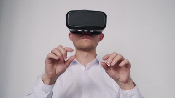 Attractive Man with Vr Helmet on Head Typing on Invisible Keywor