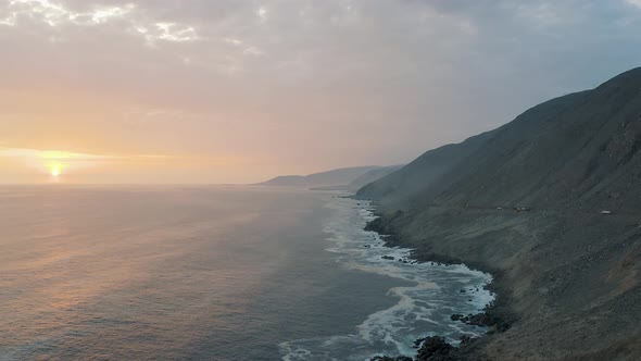 Aerial view during sunset of Pacific Ocean, the coast in Peru 4K