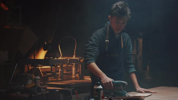 Cinematic Video of a Carpenter at Work in a Carpentry Workshop alt