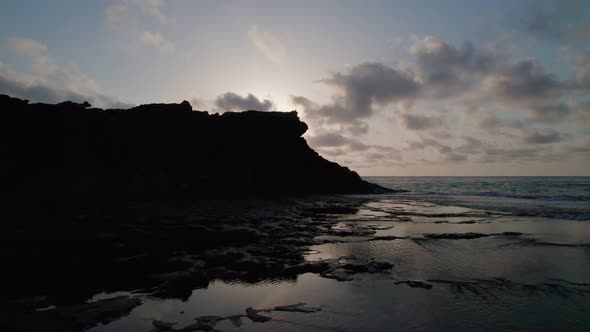 Sunrise on the rocky seashore.