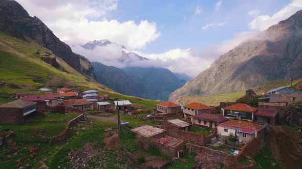 Aerial Drone View of a Lonely Mountain Village with a Dozen Houses alt