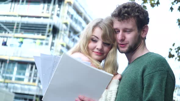 Couple On Front Of New House alt