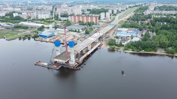 Aerial view of the construction of a new bridge across the river.