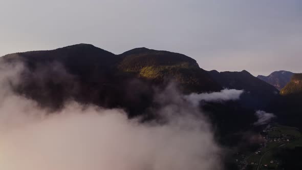 Panoramic View of a Picturesque Mountain Valley with a Village in a Lowland alt