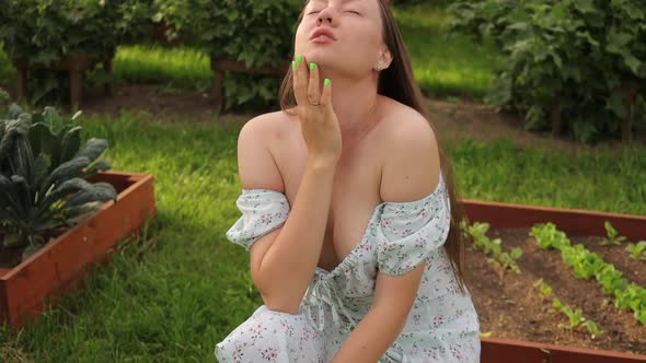 Charming Woman Sitting in Garden