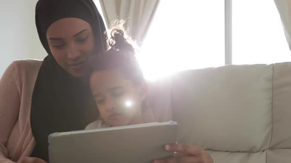 Mother and daughter at home alt