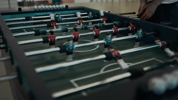 Closeup Foosball Game Table with Miniature Plastic Figures alt