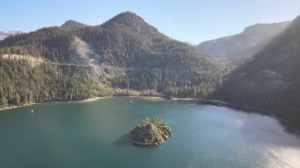 Drone shot flying backwards away from Fannette Island and Eagle falls. Granite Chief Wilderness in t alt
