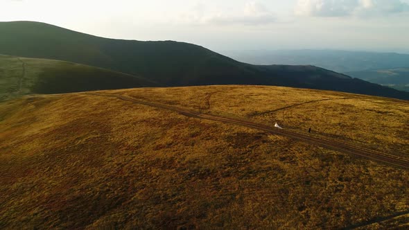 Wedding Couple Walking on Top of Mount Gemba