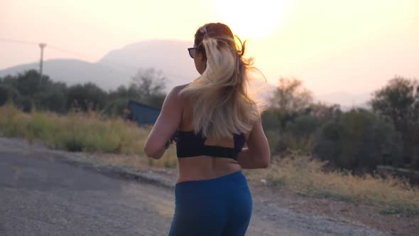 Young Woman Training for Marathon Run Outdoor alt