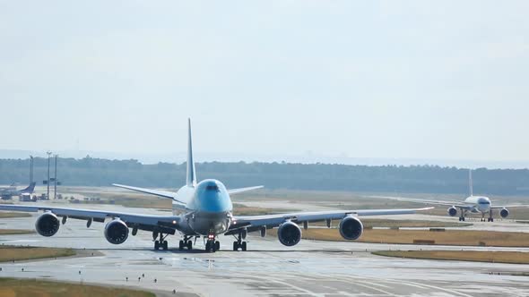 Wide-body Aircraft Taxiing To Runway for Departure. alt