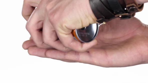 Squeezing Shaving Gel on the Male Palm. White Background. Close-up alt