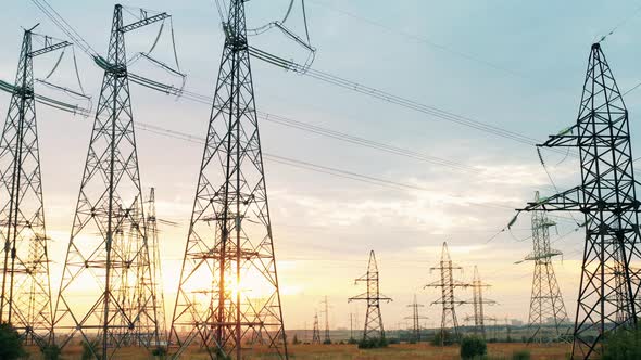 Multiple Towers of Electrical Transmission in the Field alt
