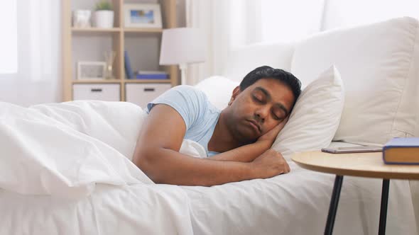 Indian Man Sleeping in Bed at Home alt