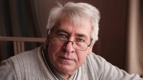 Closeup Portrait of Happy Senior Man Looking at Camera alt
