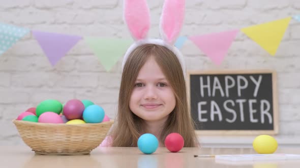 Funny Kid Girl with Bunny Ears Play Easter Hare Hunter at Home alt