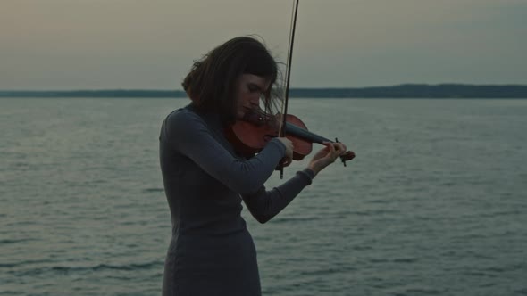 Woman Is Performing On Lakeshore alt