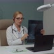 Female Doctor Diagnosing Xray Image Online Via Video Calling Indoors - VideoHive Item for Sale