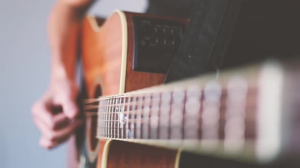 Crop man playing guitar alt