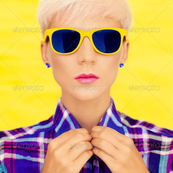 fashion portrait of a girl in fashion sunglasses - Stock Photo - Images