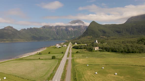Farm Landscape Of Village Of Mevik With Rural Road And Mevik Chapel In Gildeskal, Norway. Hognakken alt