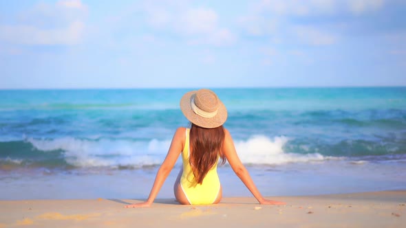 Asian woman enjoy around beautiful beach sea ocean alt