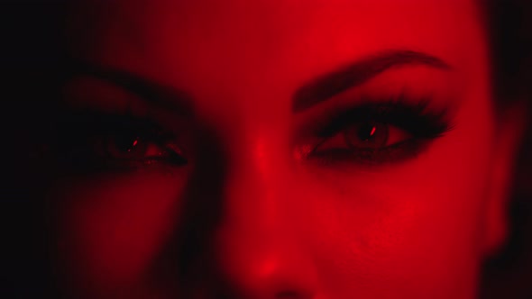 Female Face Under Neon Colorful Flashing Light alt