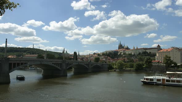 Tourist boats floating under Manes Bridge alt