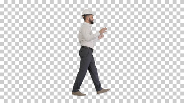 Engineer in hardhat walking and explaining something, Alpha Channel alt