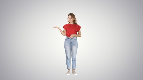 Young beautiful woman amazed and smiling to the camera alt