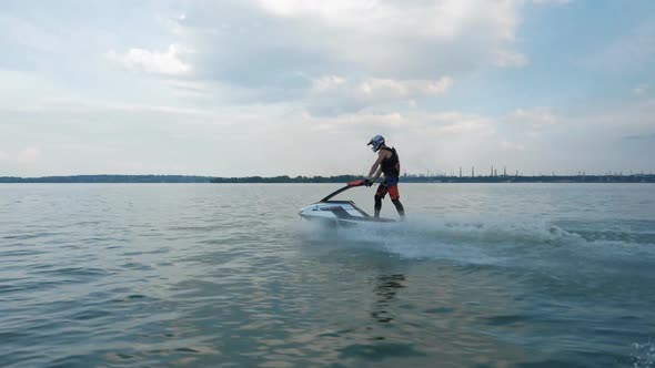 Man drive in jet ski, boat. Еxtreme summer sport. Activity leisure on sea. alt