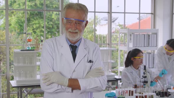 Scientist Work with Science Equipment in Laboratory alt