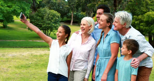 Multi-generation family taking a selfie on a mobile phone alt