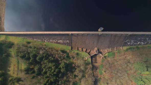 Top down aerial view above Scar house Yorkshire reservoir landmark architecture and lake water dam alt