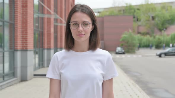 Close up of Young Woman Walking on Street, Front Pose alt