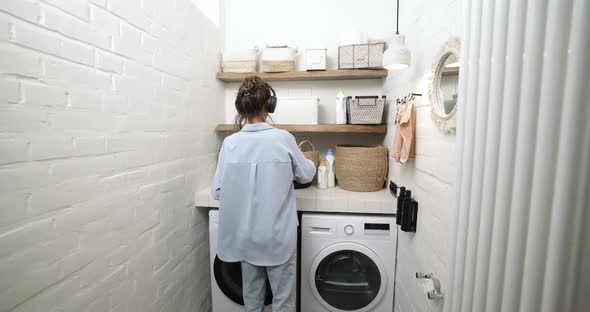 Woman Washing Clothes at Home alt